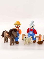 Toy figures of two farmers, horse, dog, and chicken on a white background