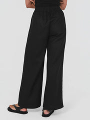 Black wide-leg pants worn by a person on a white background