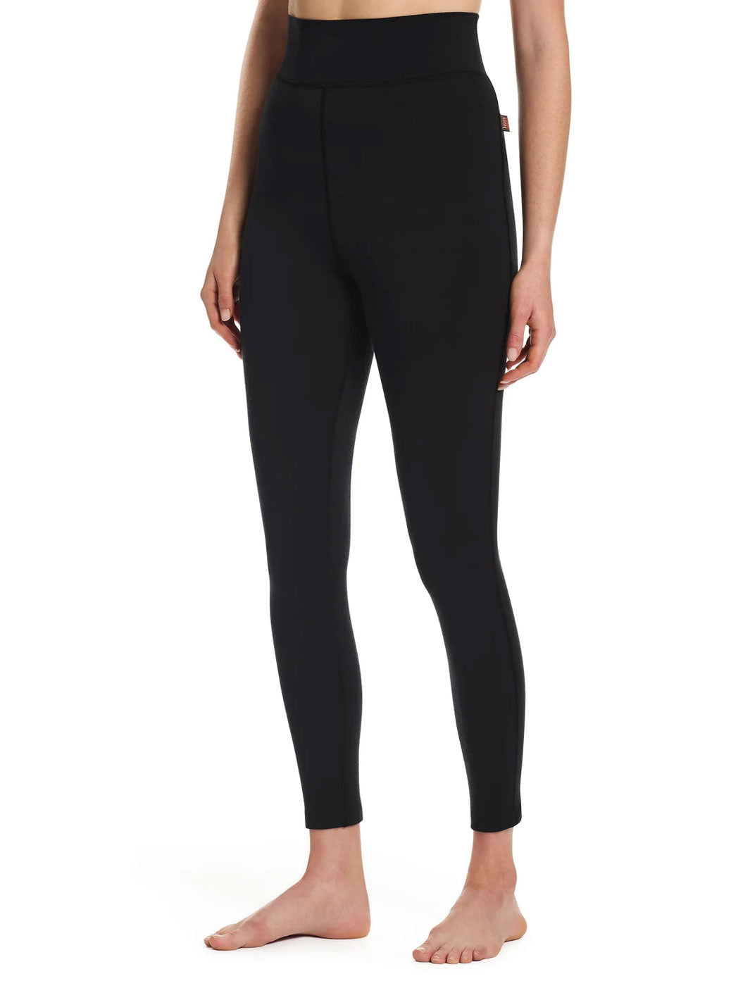 A model wearing black high-waisted leggings, shown from the waist down against a plain white background.