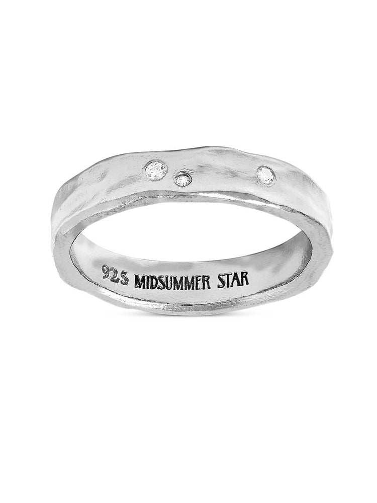 Silver ring with small cubic zirconia on a white background