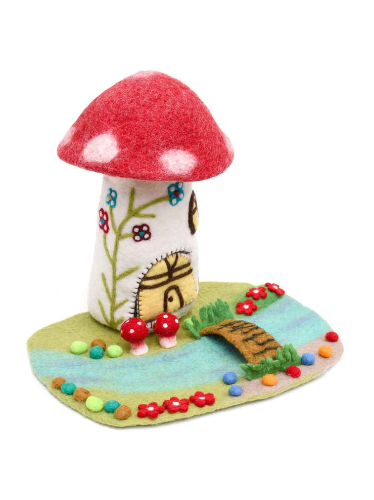 Felt mushroom house with a red cap and colourful base play mat on a white background