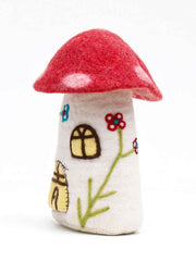 Felted mushroom toy house with a red cap and white stem on a white background