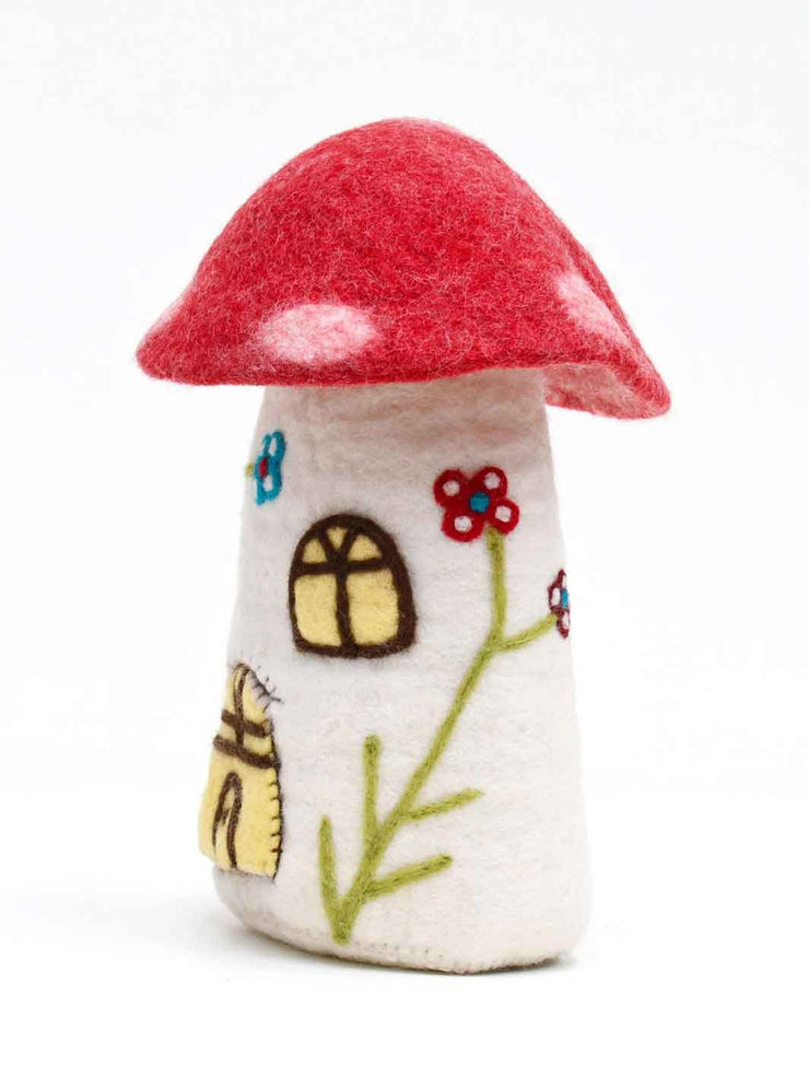 Felted mushroom toy house with a red cap and white stem on a white background