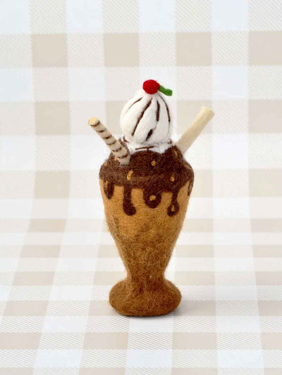 Felted chocolate milk shake toy and sundae on a checkered background