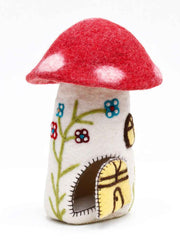 Felted mushroom-shaped toy house with red cap and white spots on a white background