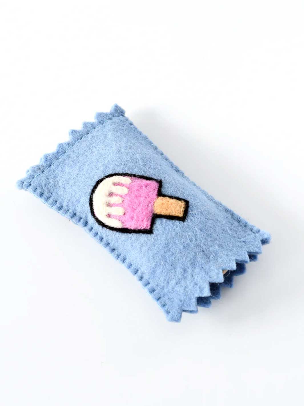 A light blue felt hair claw clip with a cute embroidered popsicle design in the center, set against a plain white background.
