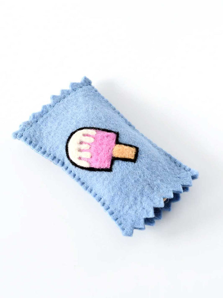 A light blue felt hair claw clip with a cute embroidered popsicle design in the center, set against a plain white background.
