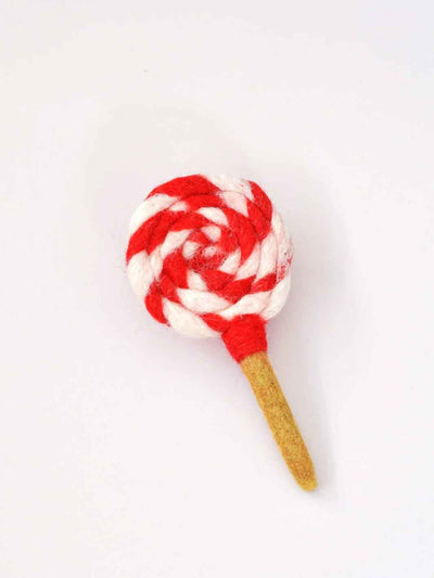 Red and white striped lollipop toy on a white background