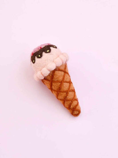 Felted ice cream cone toy on a pink background