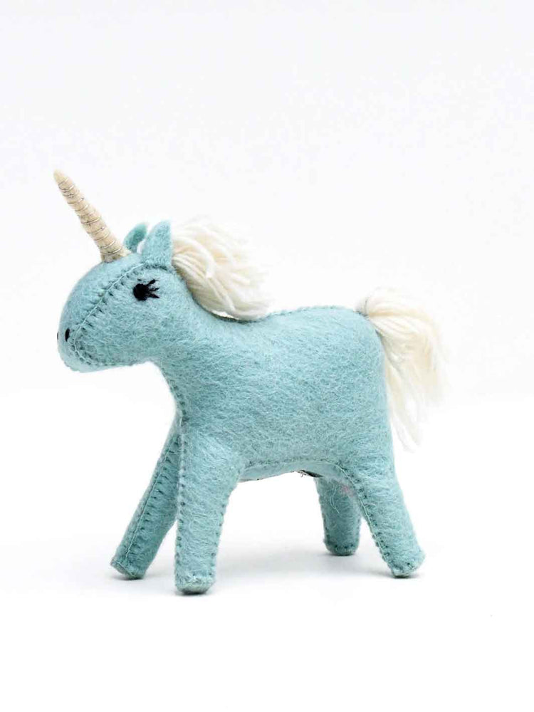 Felt unicorn toy in light blue on a white background