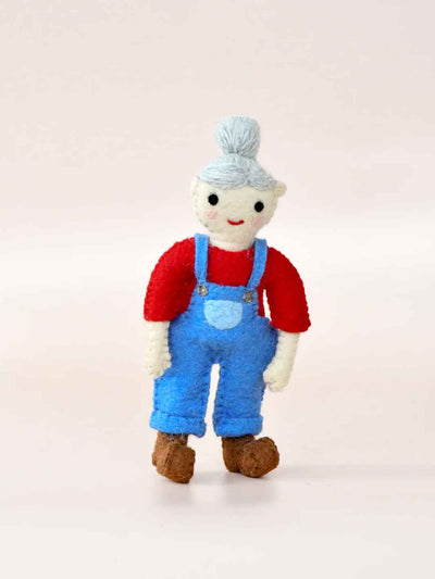 Felt toy figure wearing a red shirt, blue overalls, and a gray hat on a light background. Female Farmer