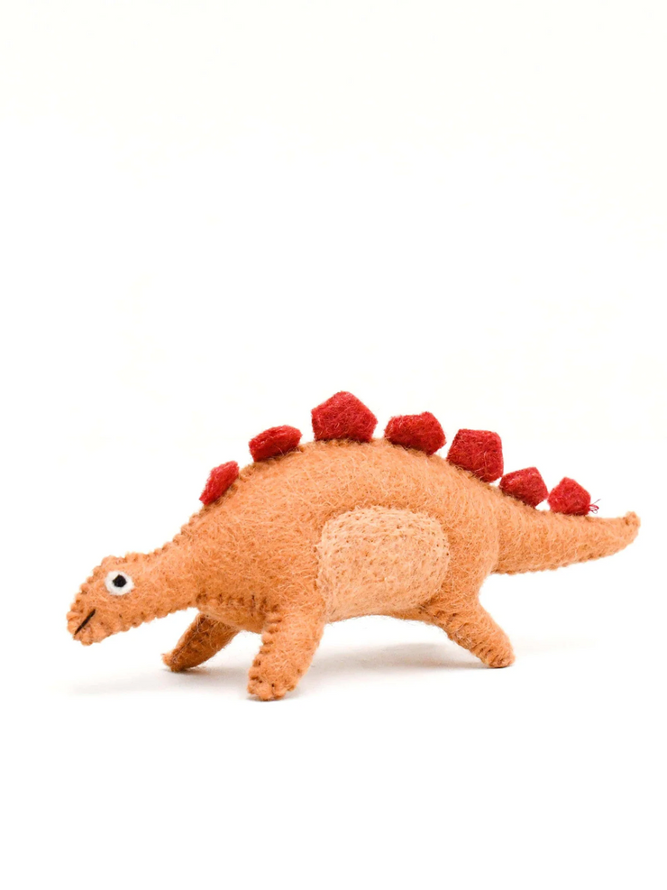 Plush orange felt toy dinosaur with red spikes on a white background