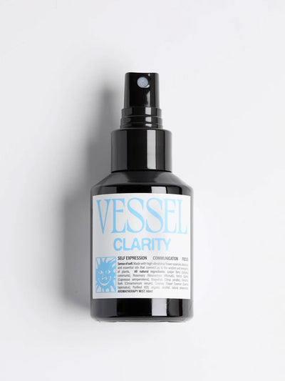 Black glass spray bottle labeled 'Vessel Clarity' on a light gray background. By Vessel Apothecary at Meadow Store