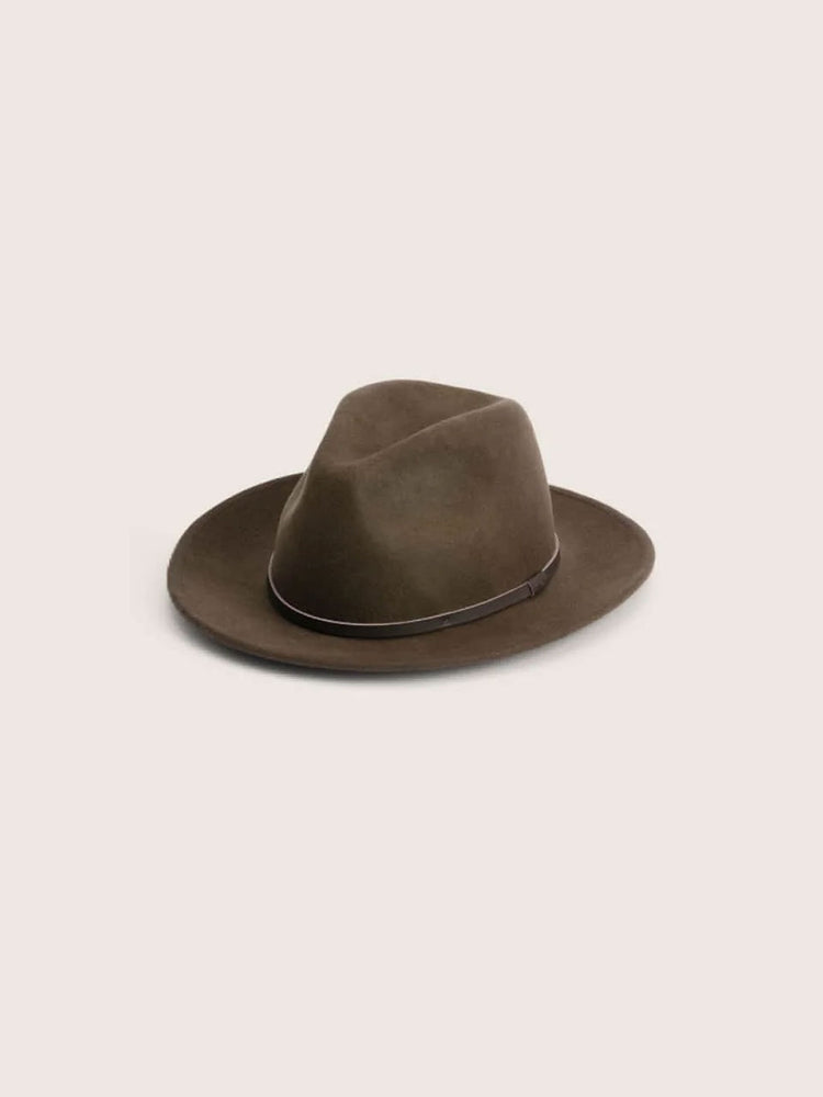 A dark brown children's felt fedora hat with a matching dark band, photographed from a top-down angle on a solid light beige background.