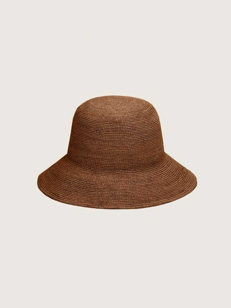 A brown woven straw bucket hat centered on a light gray background.